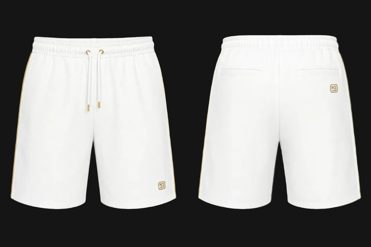 White athletic shorts shown from the front and back on a black background. The front has an elastic waistband with a white drawstring and a small gold logo patch near the lower left leg.